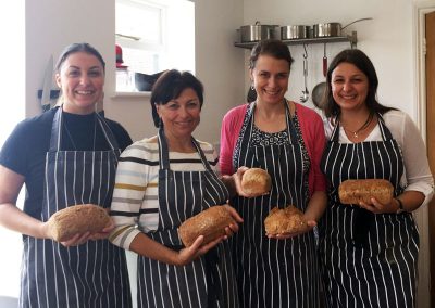 Course attendees holding bread